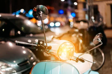 Foto auf Acrylglas Hellblauer Retro-Scooter auf der Straße © teksomolika