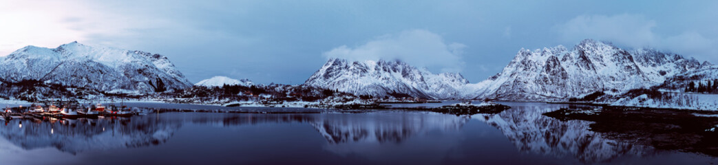 Fototapeta na wymiar Landscape with beautiful winter lake and snowy mountains at Lofoten Islands in Northern Norway. Panoramic view