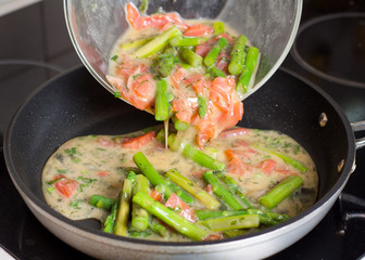 Preparation of frittata with smoked trout and asparagus