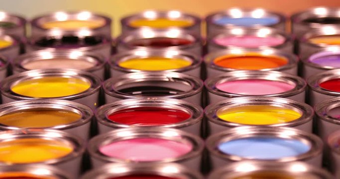 Full Buckets of rainbow colored oil paint 