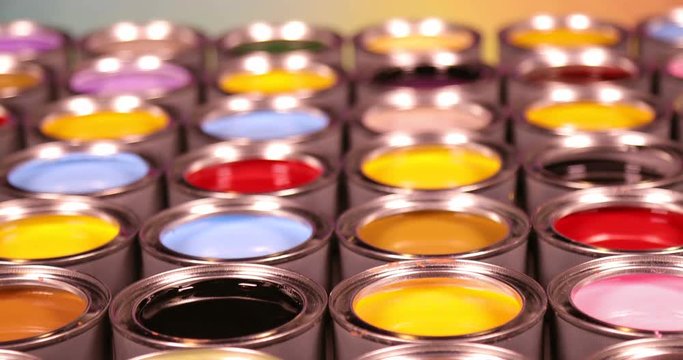 Full Buckets of rainbow colored oil paint 