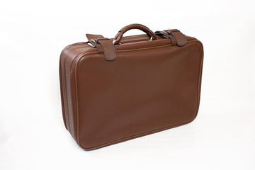 Brown leather suitcase isolated on white background