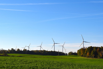 Fototapeta na wymiar Wind Power Windmills Renewable Clean Green Energy Electricity Turbines