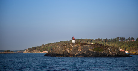 Fototapeta na wymiar Scandinavia, archipelago from the sea, rocks, lighthouse 