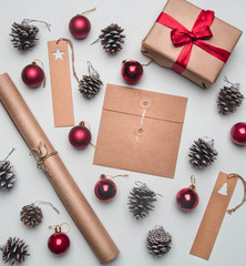 Christmas concept, postcard, gift box, Christmas toys and cones, on a white background, flat lay