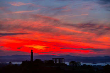 Silhouette of monuments on Calton Hill on beautiful sky on background, Edinburgh, Scotland
