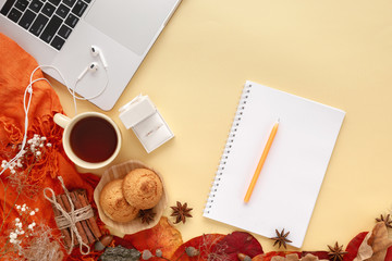Wedding ring in white gift box, laptop, headphones and notebook