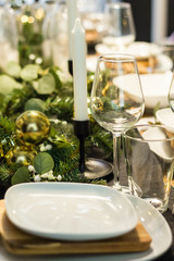 Table served for Christmas dinner in living room, close up view