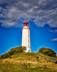 Fototapeta na wymiar Old lighthouse Dornbusch on sunny summer day. Hiddensee, Baltic Sea.