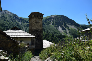 Fototapeta na wymiar Adishi is a remote village just below Adishi glacier close to Mestia is a highland town in Svaneti region in the Caucasus Mountains, Georgia, It is dominated by stone defensive towers (Svan towers).
