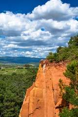 Ochre cliffs and rock formations near the village of Roussillon in the Luberon area of Provence,...