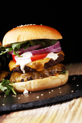 Tasty fresh meat burgers with salad and cheese. Homemade angus burger.