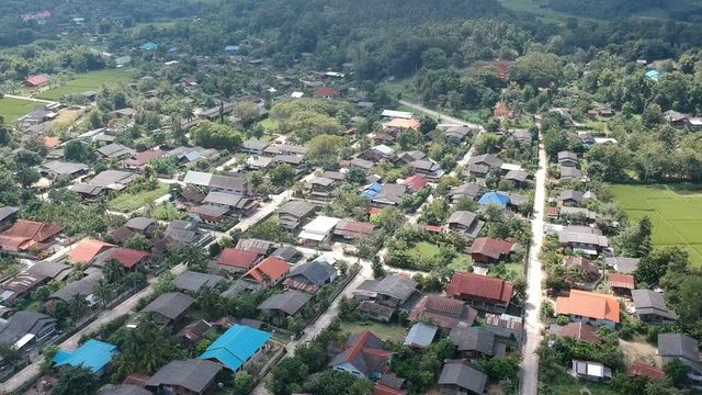 aerial view of countryside village in Thailand. Landing shot.