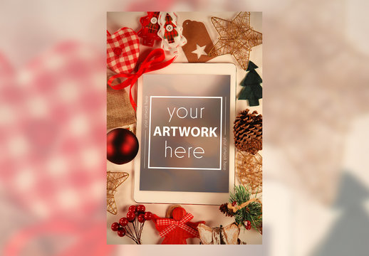 Tablet and Holiday Decorations on Table Mockup