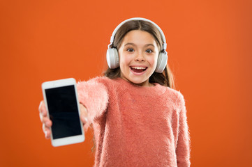 Get music family subscription. Access to millions of songs. Enjoy music concept. Best music apps that deserve a listen. Girl child listen music modern headphones and smartphone. Listen for free