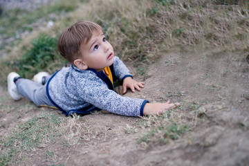 boy climbing the hill