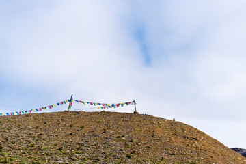 Traditional buddhist prayer flags over foggy mountain background in Annapurna Conservation Area,...
