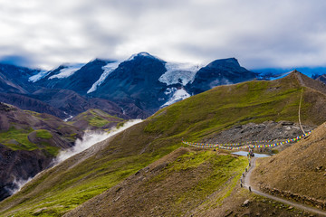 Fototapeta premium Traditional buddhist prayer flags over foggy mountain background in Annapurna Conservation Area, Nepal
