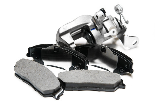 brake pads with shallow depth of field on a white background