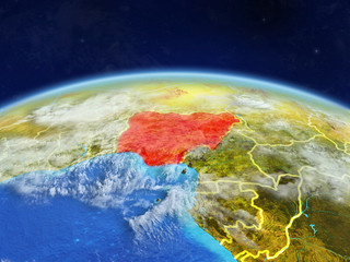 Nigeria on planet Earth with country borders and highly detailed planet surface and clouds.