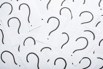 Question mark heap on table concept for confusion, question or solution