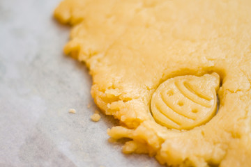 Raw dough for christmas cookies for children, making gingerbread in form of ball close-up. New year treat for Santa Claus cooking. Homemade bakery, xmas sweet, winter holidays concept