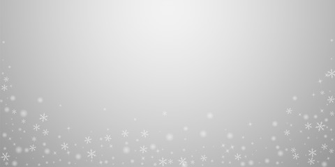 Sparse glowing snow Christmas background. Subtle f