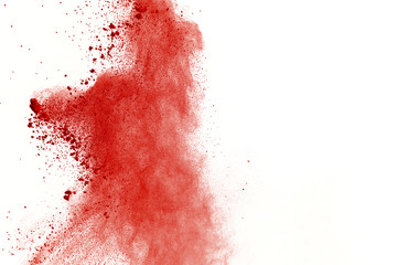 Red powder explosion on white background. Paint Holi.