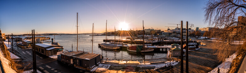 Sunset over sailboats in the marina of Oslo, Norway