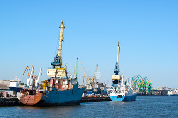 Naklejka premium seaport, crane in port, concept of shipping