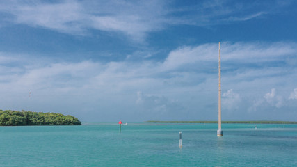 Telephone poles over water near Key West, Florida, USA