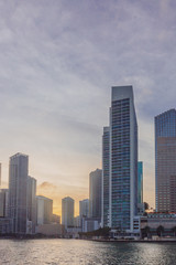 Fototapeta na wymiar Buildings by water in the Biscayne Bay of Miami, Florida, USA, at sunset
