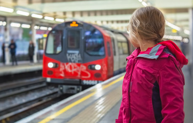 Girl waiting for a train