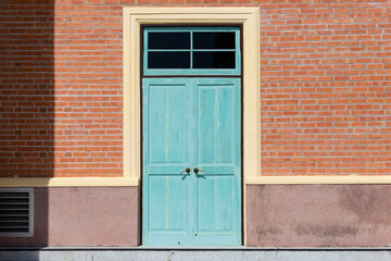 Old door vintage with subframe and brick wall, exterior building., Background concept.