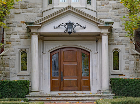 elegant front door with stone columns
