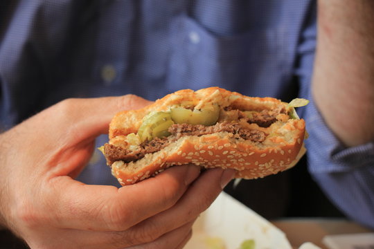Man holding a hamburger