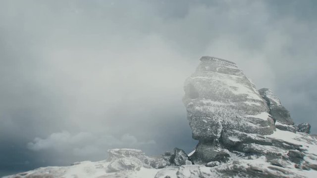 Sphinx in the Bucegi Mountains during snowstorm