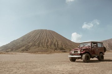 4x4 car service for tourist on desert at Bromo Mountain, Mount Bromo is one of the most visited tourist attractions in Java, Indonesia © Pantira