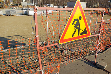 Reconstruction of pedestrian footpath. Warning sign about road works