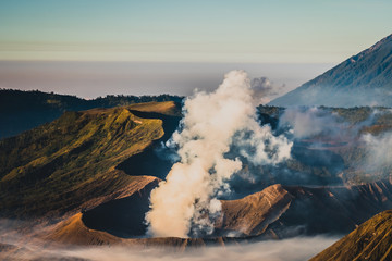 Fototapeta premium Mount Bromo volcano (Gunung Bromo), and Batok during sunrise from viewpoint on Mount Penanjakan, in East Java, Indonesia. Early morning.