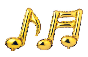Musical note of golden foil balloon isolated on a white background