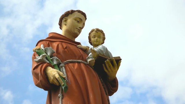 "Statue of Saint Anthony holding baby Jesus at Maria Radna Franciscan Monastery Lipova, Arad county, Romania. Maria Radna, the most significant place of pilgrimage in south-eastern Europe. Magic Lante