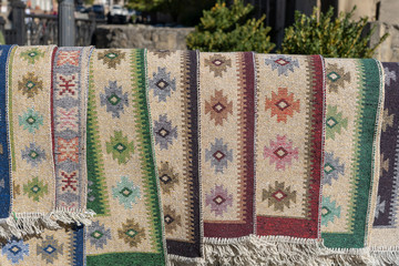 Traditional Georgian carpets and kilim rugs with typical geometrical patterns for sale, Tbilisi, Georgia