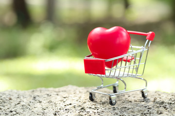 trolley with heart, idea for shopping using as business background