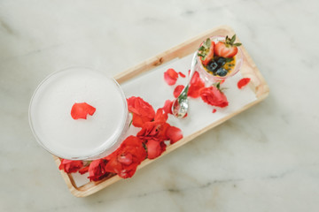 fruits cocktail and Panna cotta with rasperry and mint topping with strawberry sauce and rose petal...