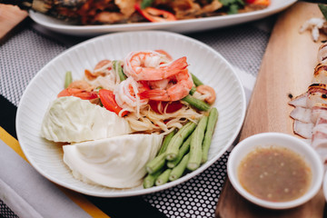 Green Papaya Salad(Som tum Thai) on wood table