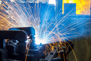 Welding robots movement in a car factory