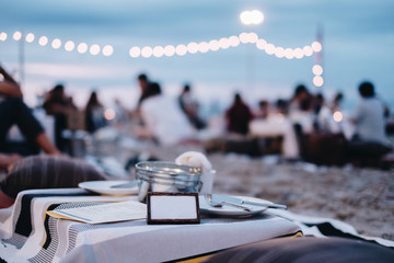 Seafood Dinner at restaurant view on night beach . Image has vintage effect, Grain and noise was...