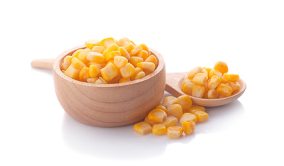 sweet corn in wooden bowl and spoon isolated on white background