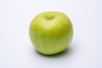 Green apple with white background close up